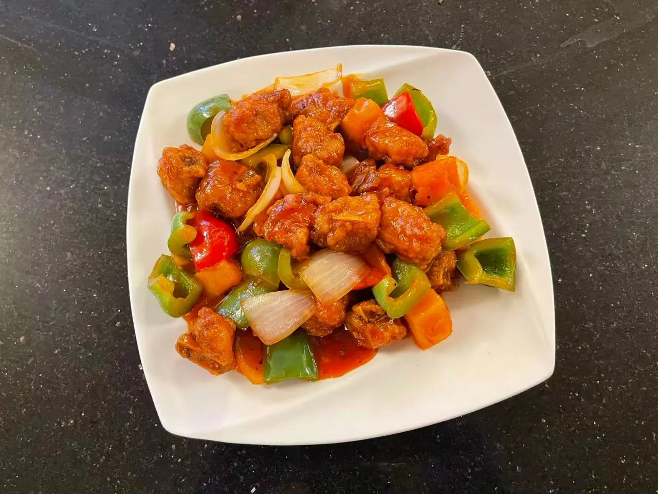 Braised meat stir‑fried with bell peppers, onion and carrot chunks